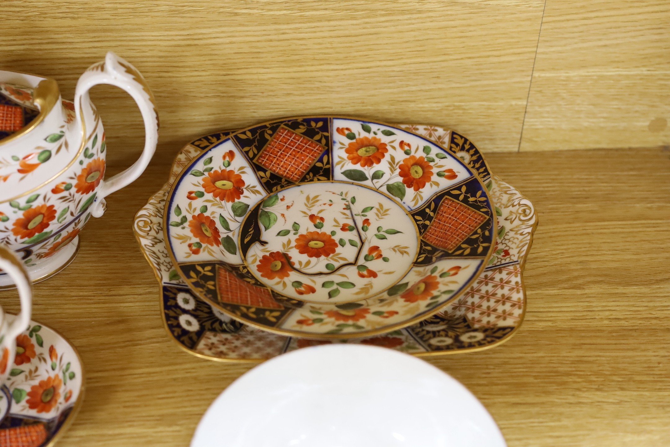 A 19th century English porcelain part tea and coffee set, probably Coalport and a similar Wedgwood part set